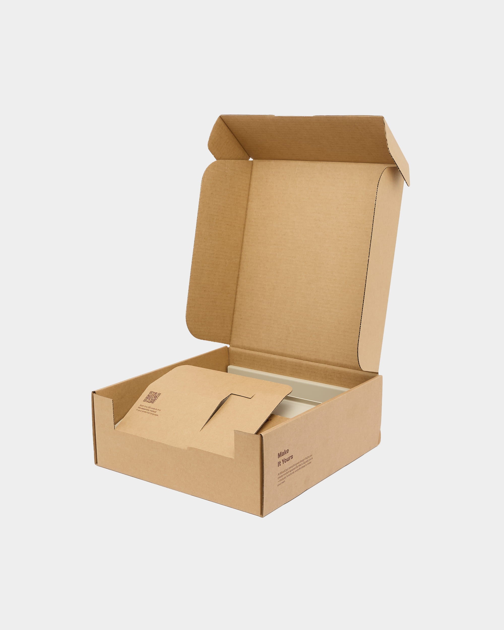 Open corrugated cardboard box with internal cardboard insert on a plain light grey background.